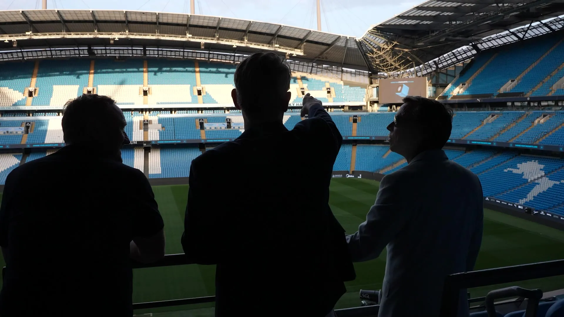 Guests looking out over the pitch at a client event at the Etihad Stadium