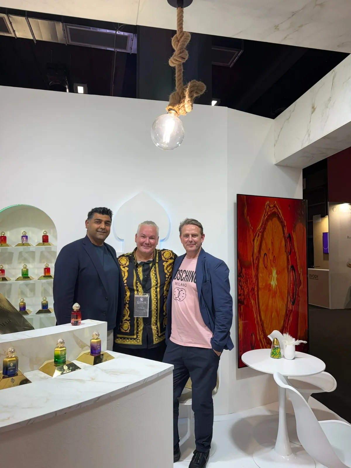 Kirk Thomason with two partners at the Evody fragrance stand