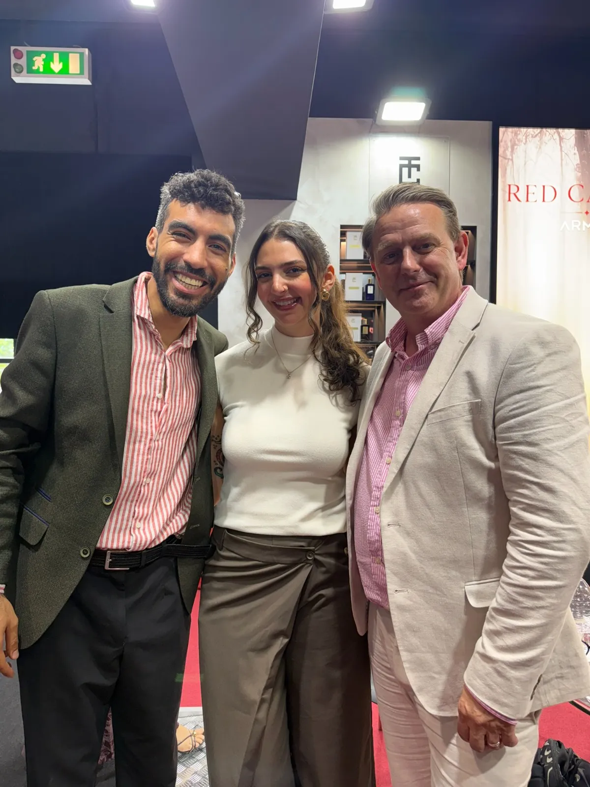 Kirk Thomason with two fragrance creators at the Red Carpet by ARMAF stand