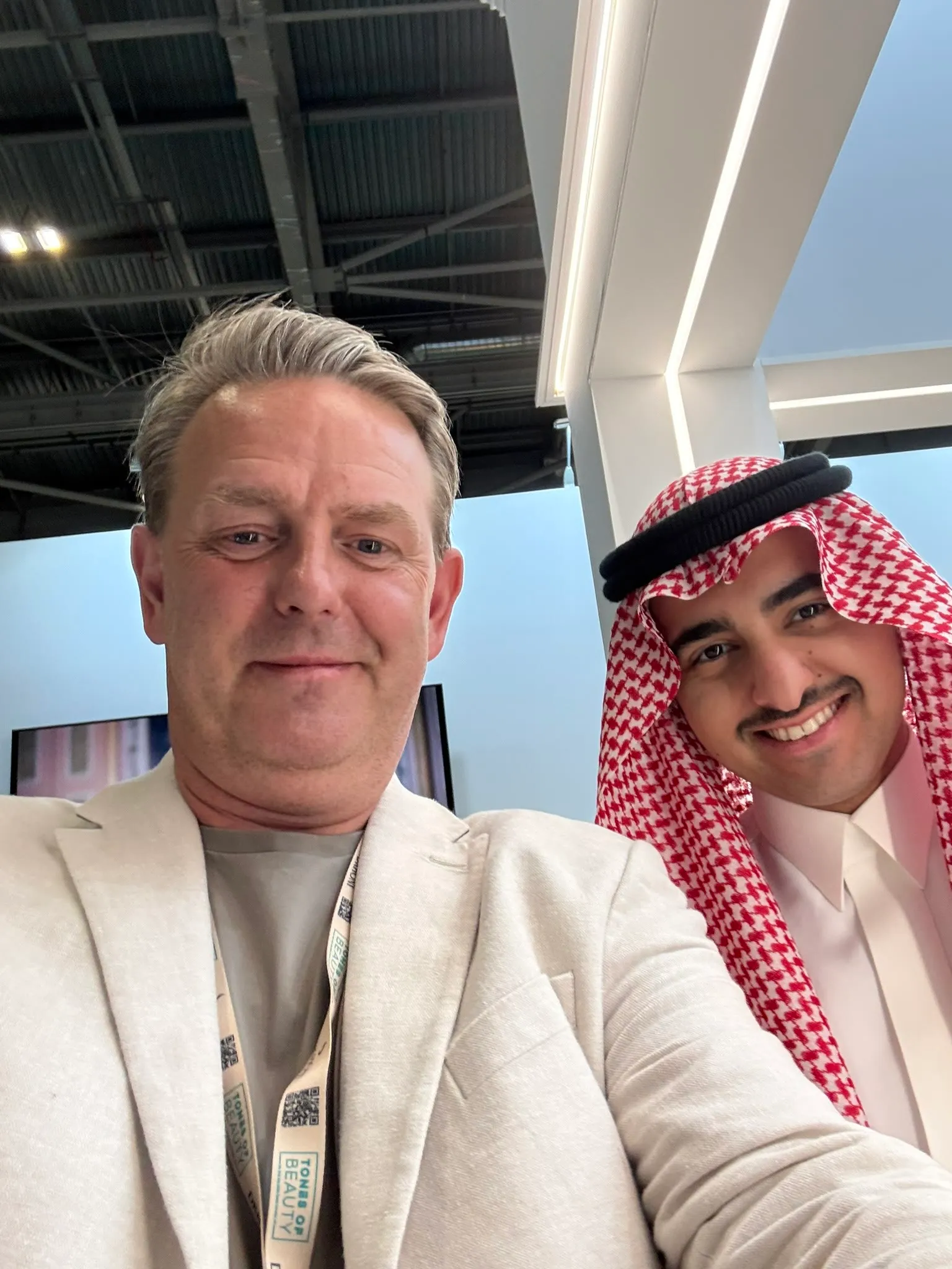 Kirk Thomason with a partner at a Middle East beauty trade show